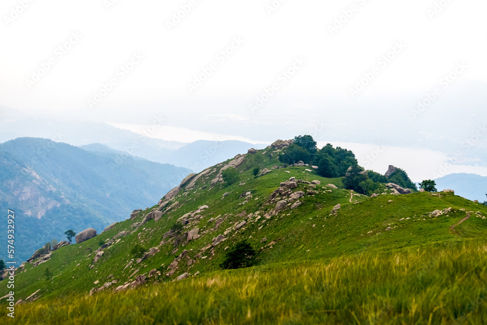 Green hills and valleys in the Alps mountains in Italy