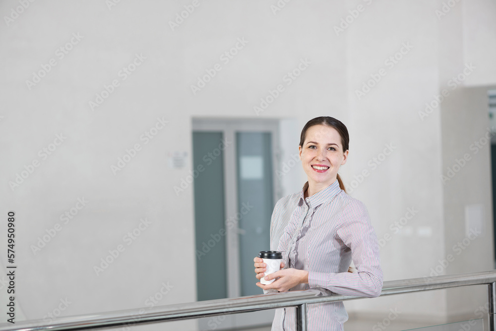 young attractive business woman with a cup of coffee