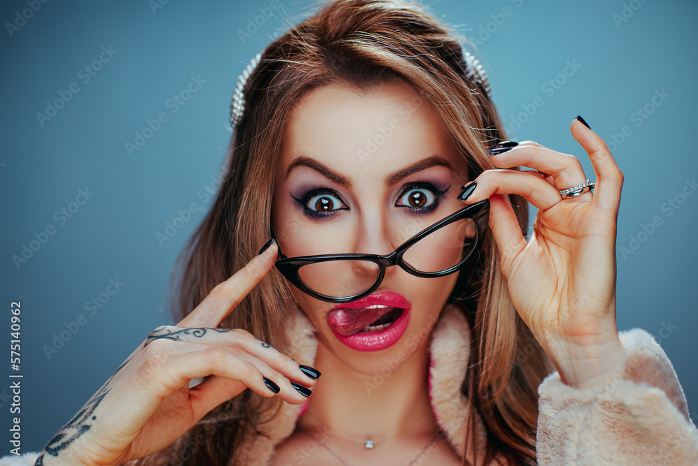 Young woman with glasses emotional studio portrait