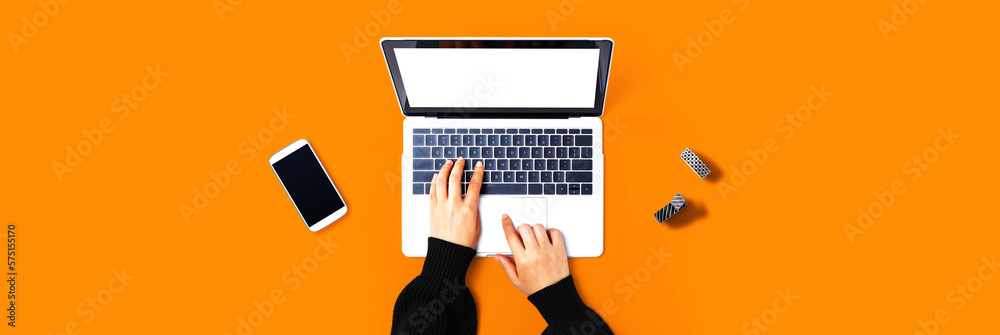 Person using a laptop computer from above