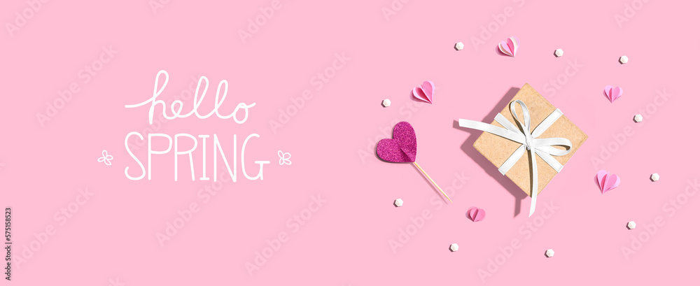 Hello spring message with a small gift box and paper hearts