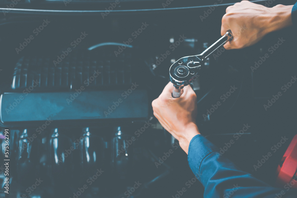 Car service, repair, maintenance concept. Auto mechanic working