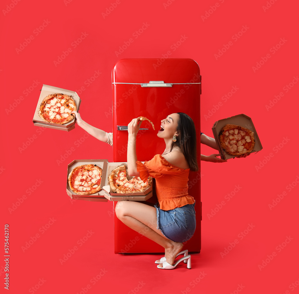 Beautiful woman and hands with tasty pizza behind fridge on red background