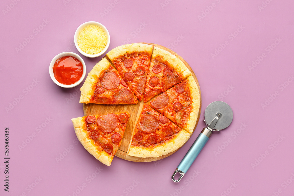 Board with slices of delicious pepperoni pizza and cutter on lilac background