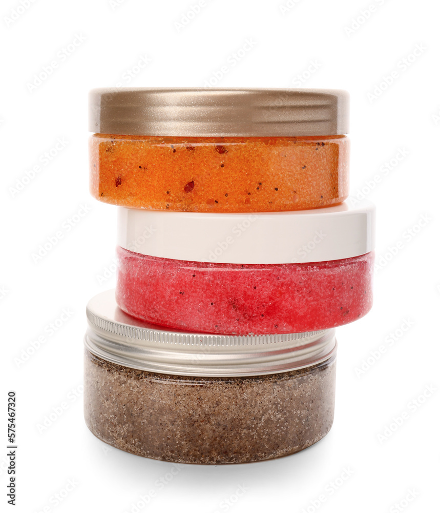 Jars with natural body scrub on white background