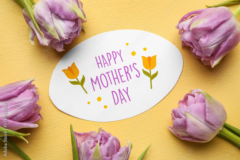 Card with text HAPPY MOTHERS DAY and beautiful tulip flowers on yellow background, closeup