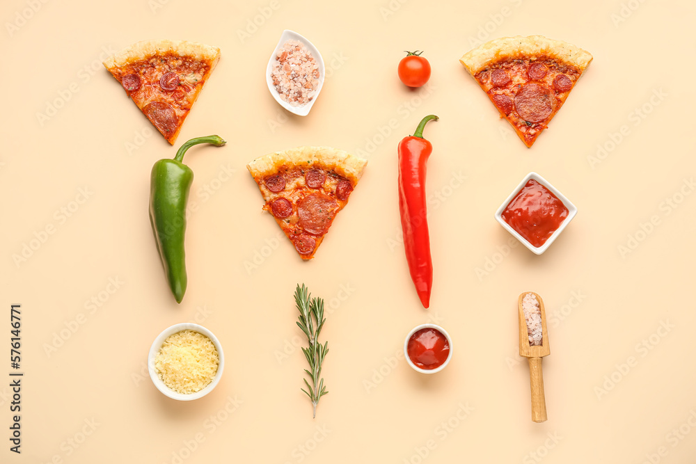 Composition with slices of delicious pepperoni pizza and ingredients on beige background