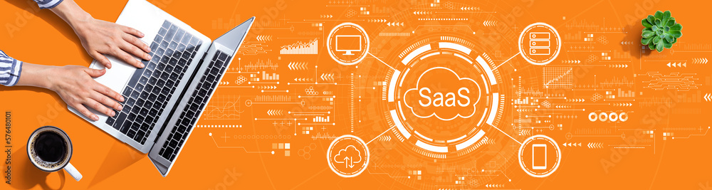 SaaS - software as a service concept with person using a laptop computer