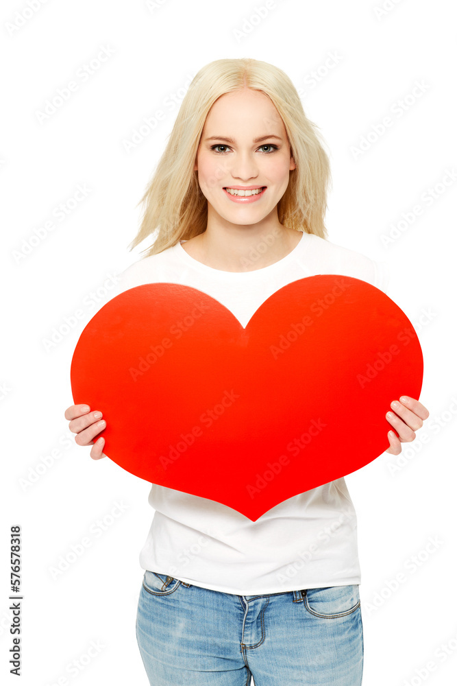 A beautiful girlfriend or a better half with a smiling face holding a heart-shaped board as a sign o