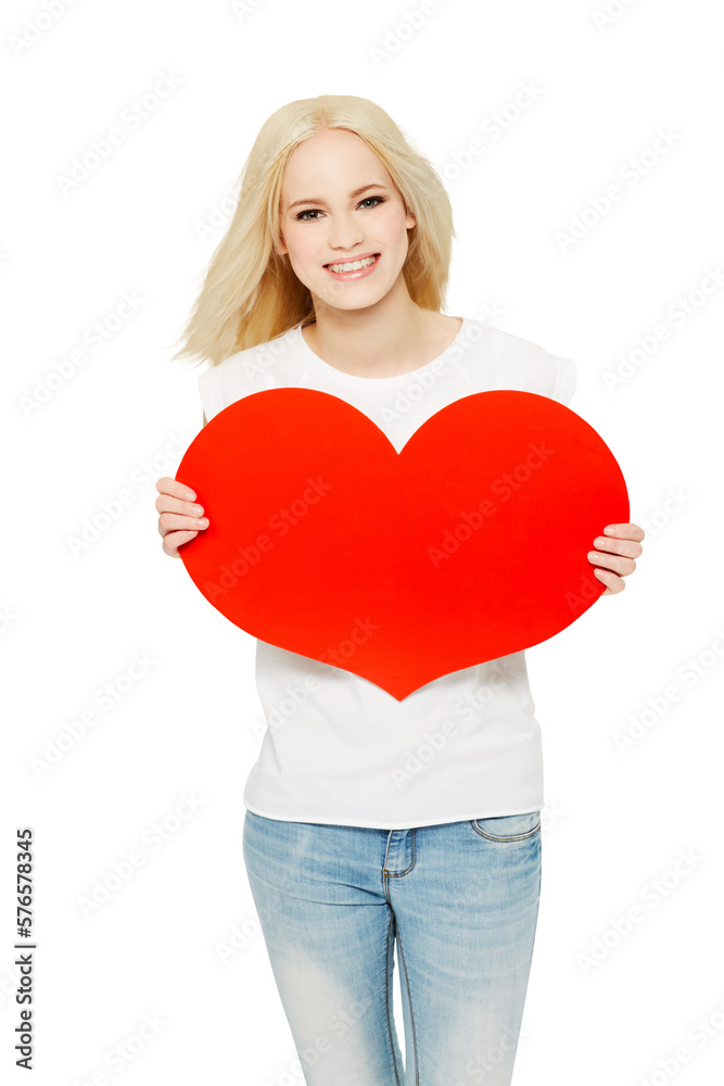 A cheerful young Australian girl holding a red heart shaped cardboard sign as a gesture of self-love