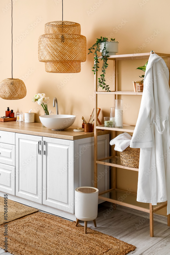 Interior of bathroom with sink, counters and shelving unit