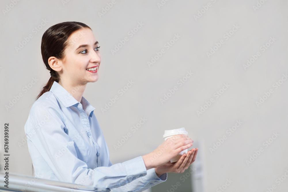 young attractive business woman with a cup of coffee