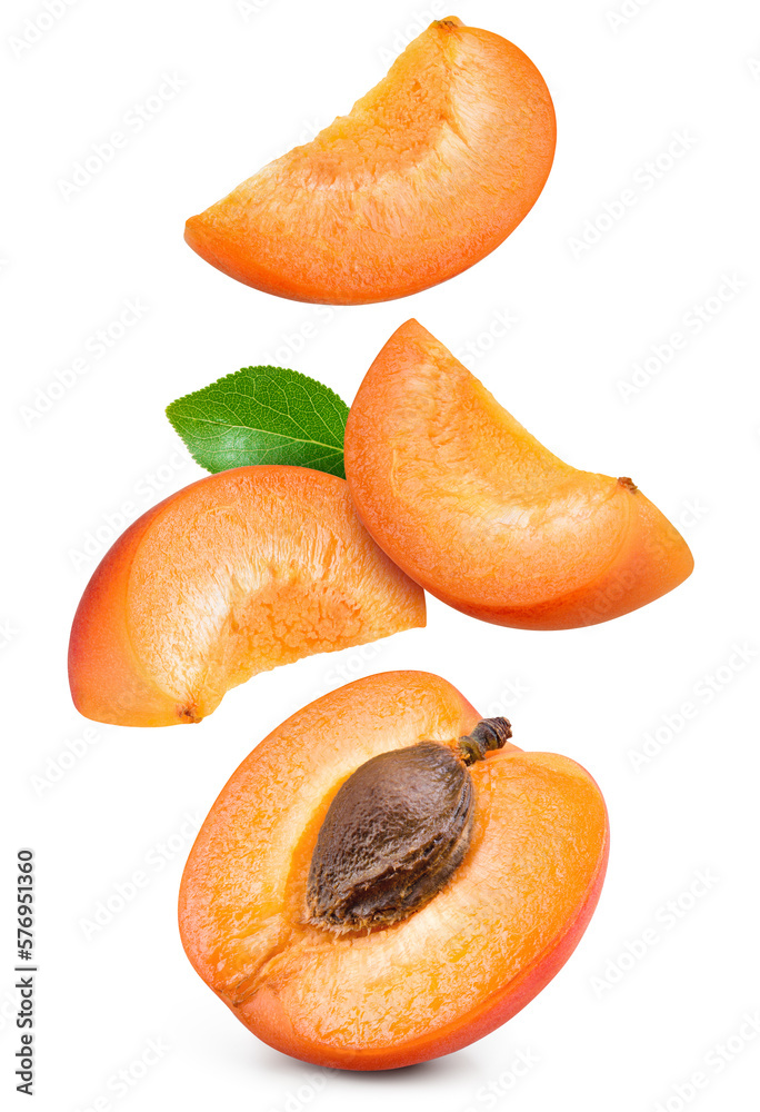 Apricot isolated. Apricot whole, half and slice are flying on white background. Apric with leaves. F