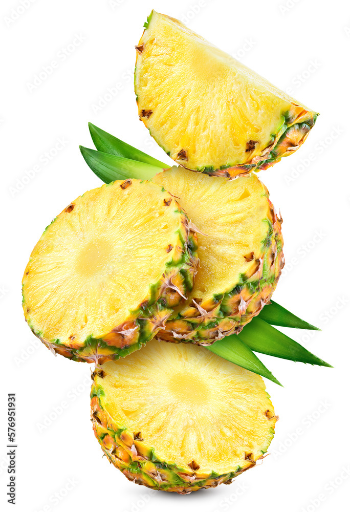 Pineapples isolated. Pineapple slices with leaves flying on white background. Cut pineapple with rou