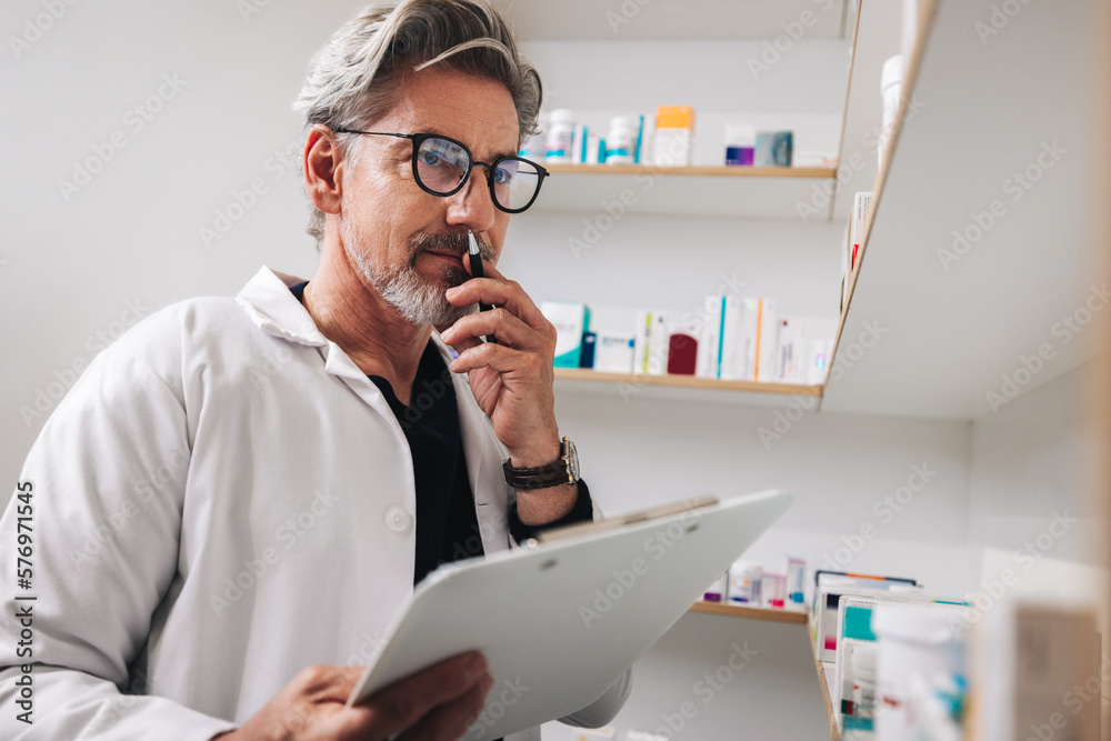 Senior man working in a pharmacy