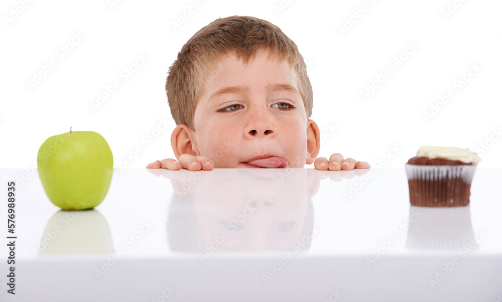 A boy faced with the decision to choose between a healthy apple and an unhealthy cupcake. He is seen