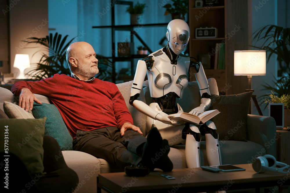 Senior man and android robot reading a book together