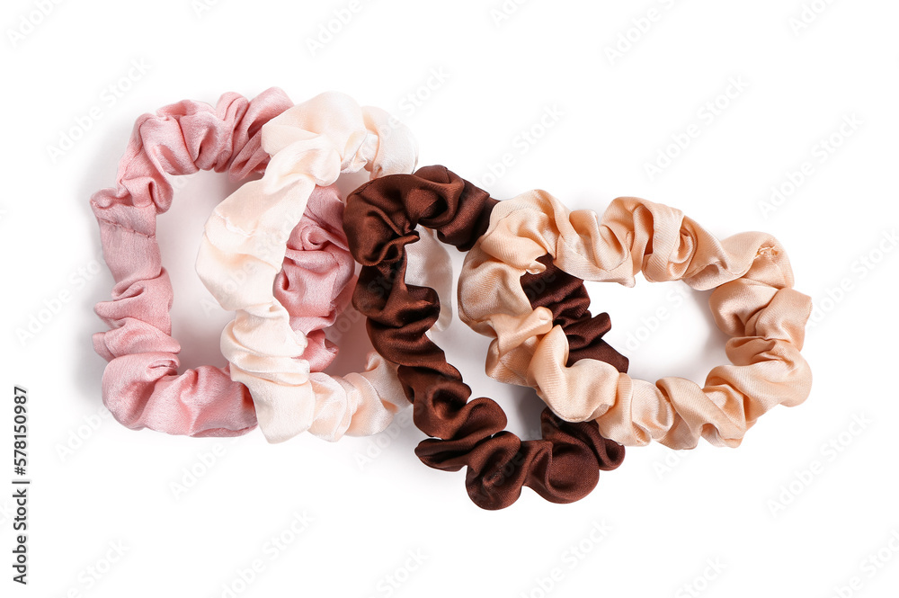 Different silk scrunchies isolated on white background