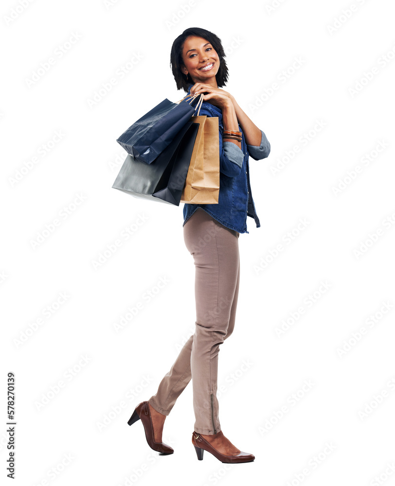 A black woman stands with her shopping bags, radiating happiness as she takes advantage of a promoti