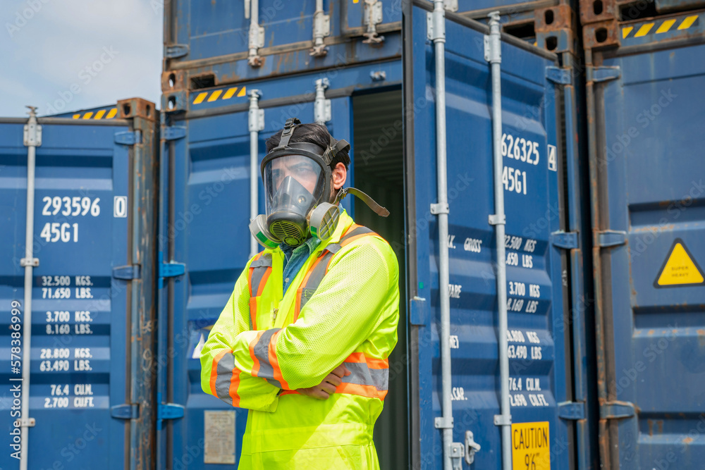 Engineer wear PPE urgently assisted the male technique inside container as Chemical spill in the con