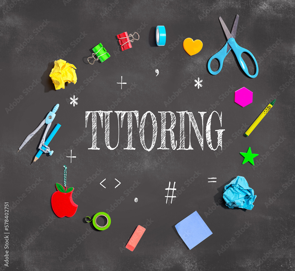 Tutoring theme with school supplies on a chalkboard - flat lay