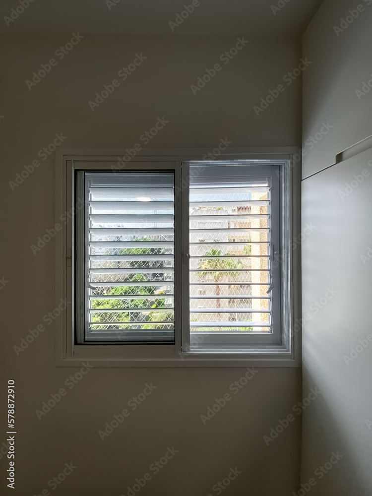 View of window with blinds in room