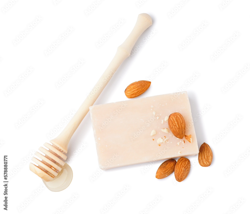 Soap bar, almond nuts and honey on white background