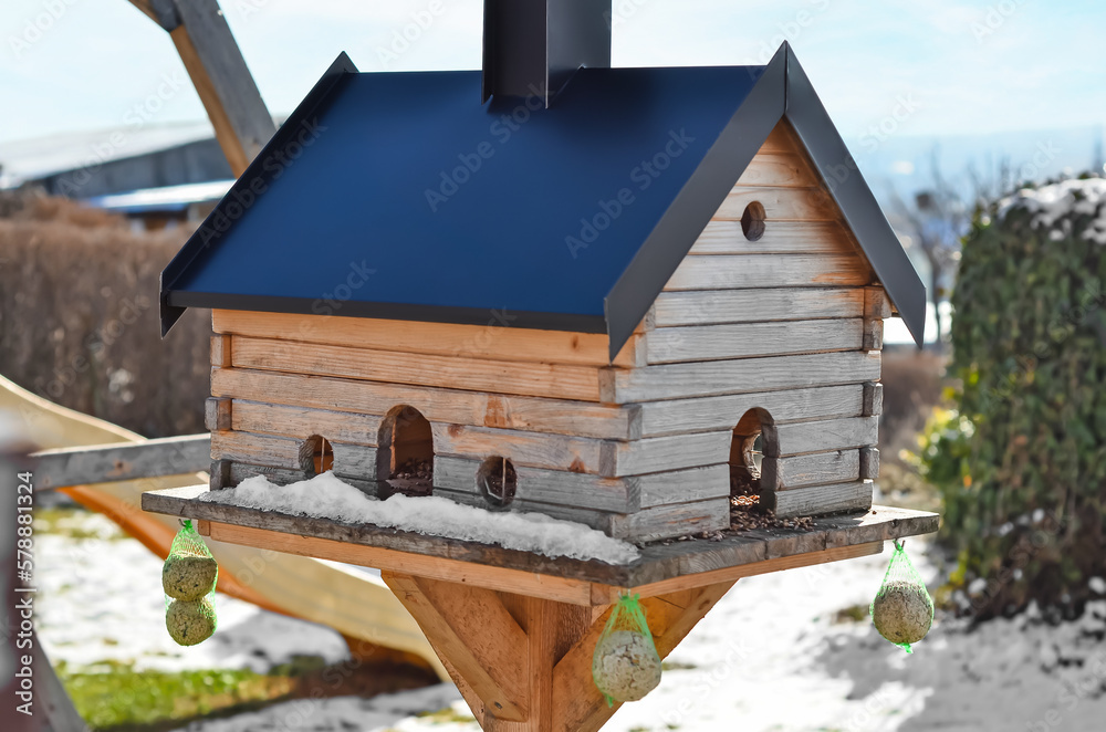 View of wooden bird house on winter day, closeup