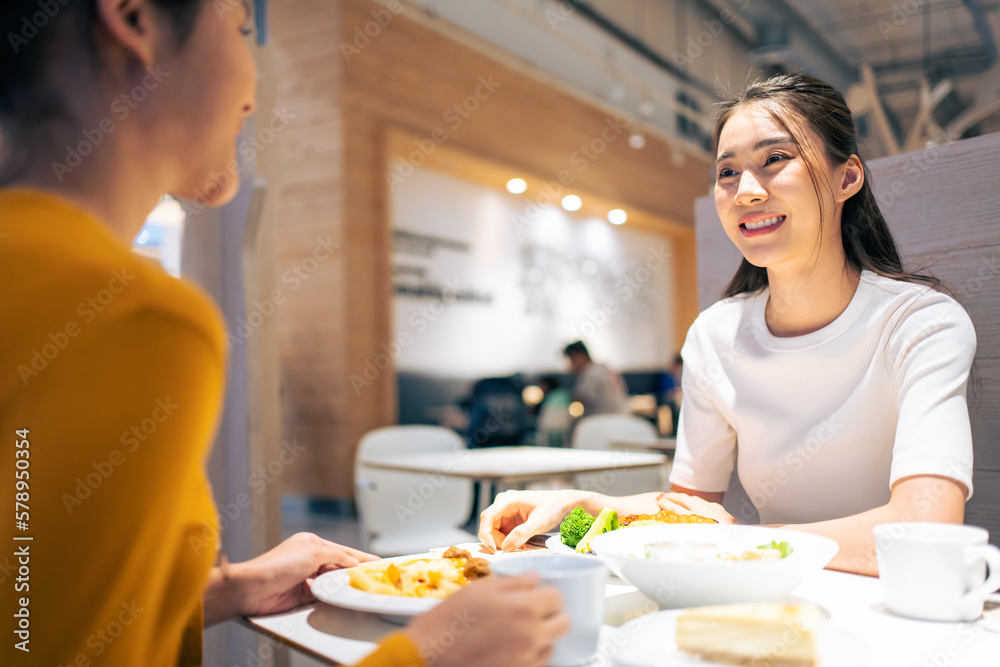 Asian beautiful women having dinner with friend in restaurant together. 