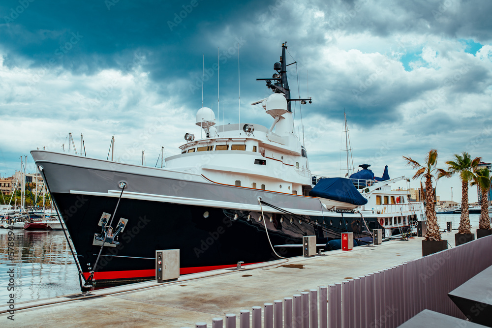 Dock with yachts summer cityscape