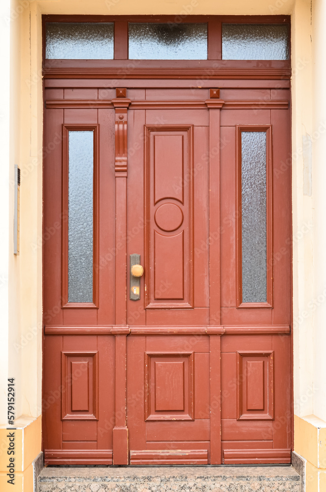 View of old building with wooden door