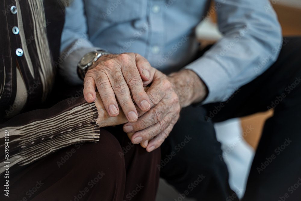 Mature couple holding hands,Expressing empathy and understanding,Trusted relationship in marriage.