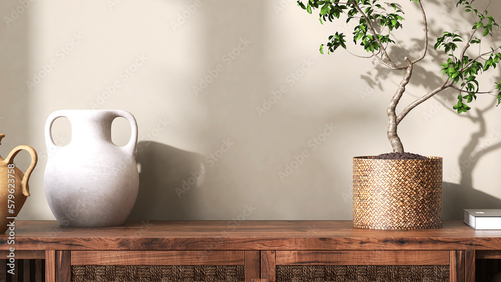 Asian antique vintage wooden cabinet top with tropical tree in rattan basket, clay vase in sunlight,