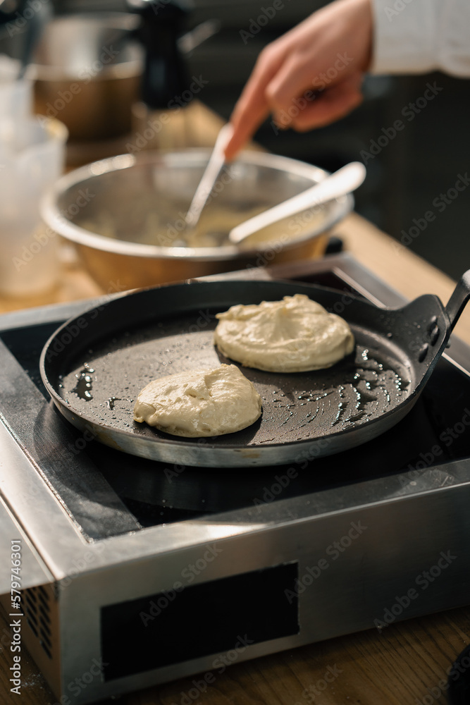 The process of making pancakes for breakfast in a frying pan Close-up