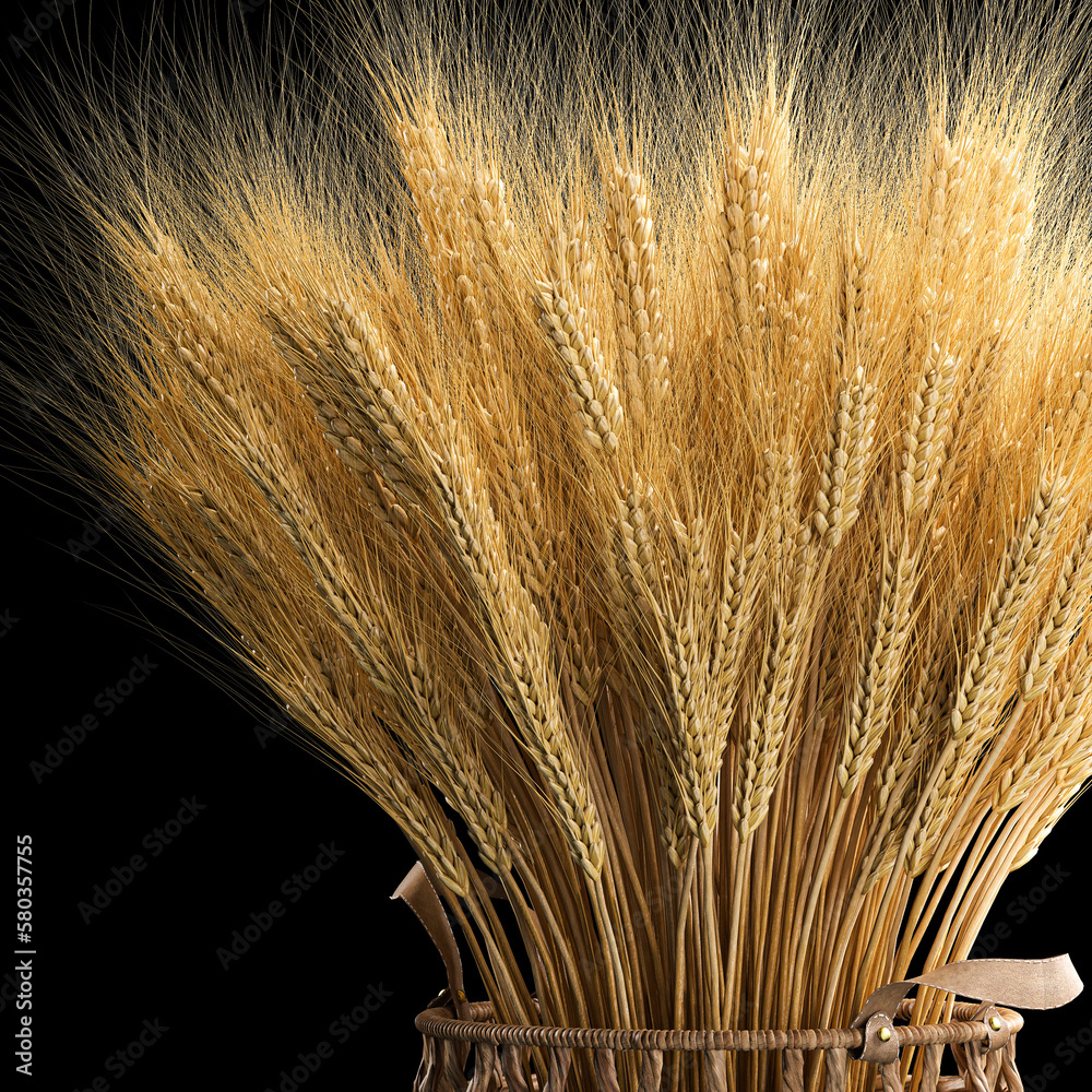 Decorative bouquet of ears of wheat in a wicker basket