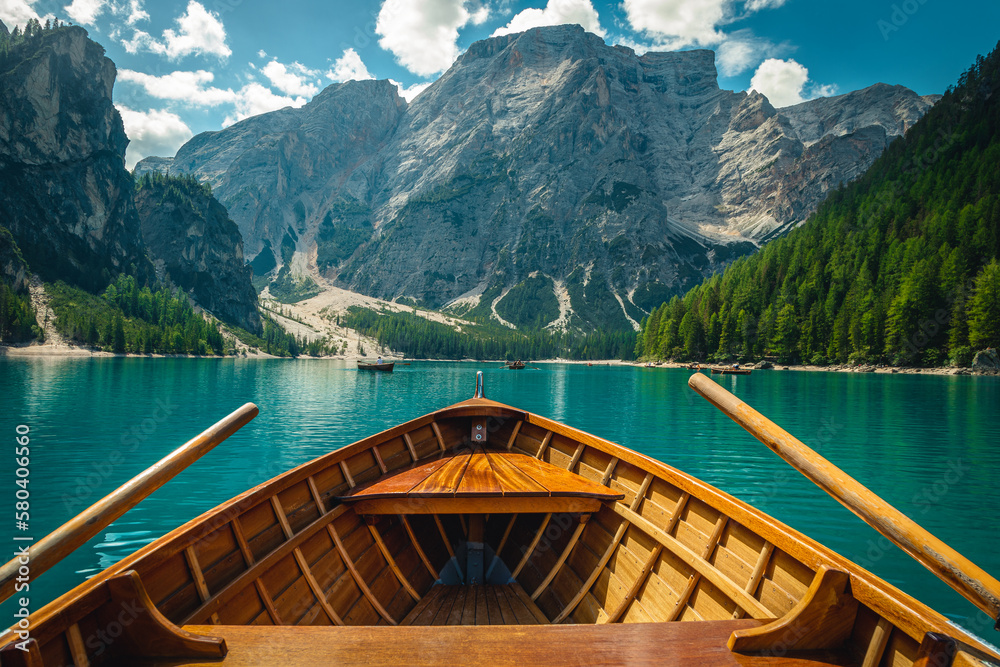 Beautiful view with high mountains from the wooden rowing boat