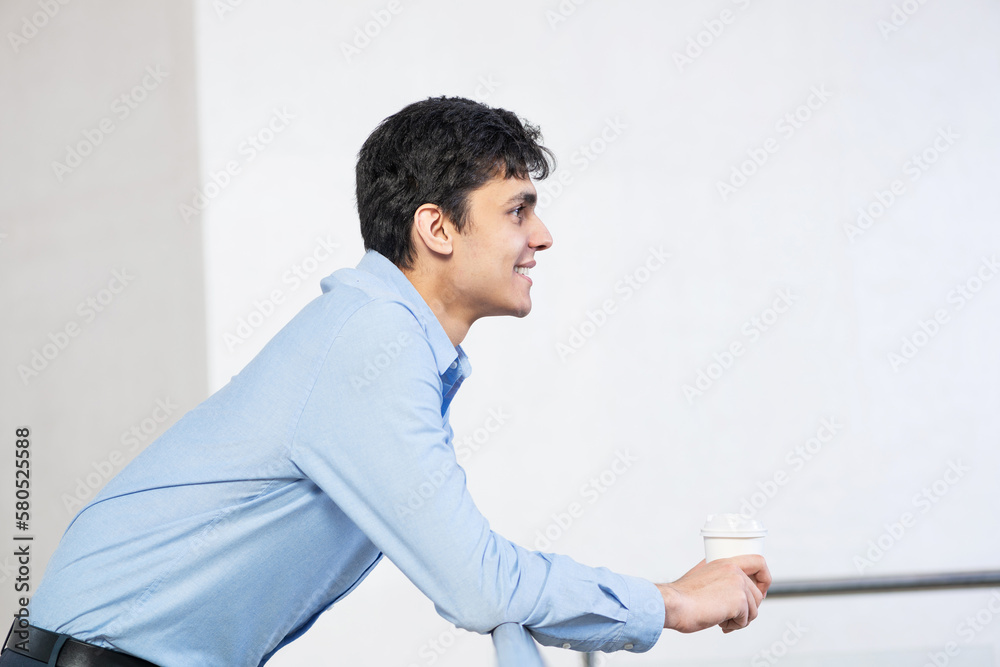 close-up portrait of a man with coffee