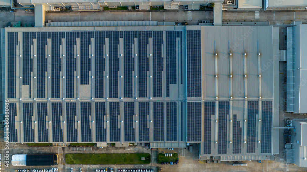 Top view Solar Panels on Warehouse Factory. Solar photo voltaic panels system power or Solar Cell on