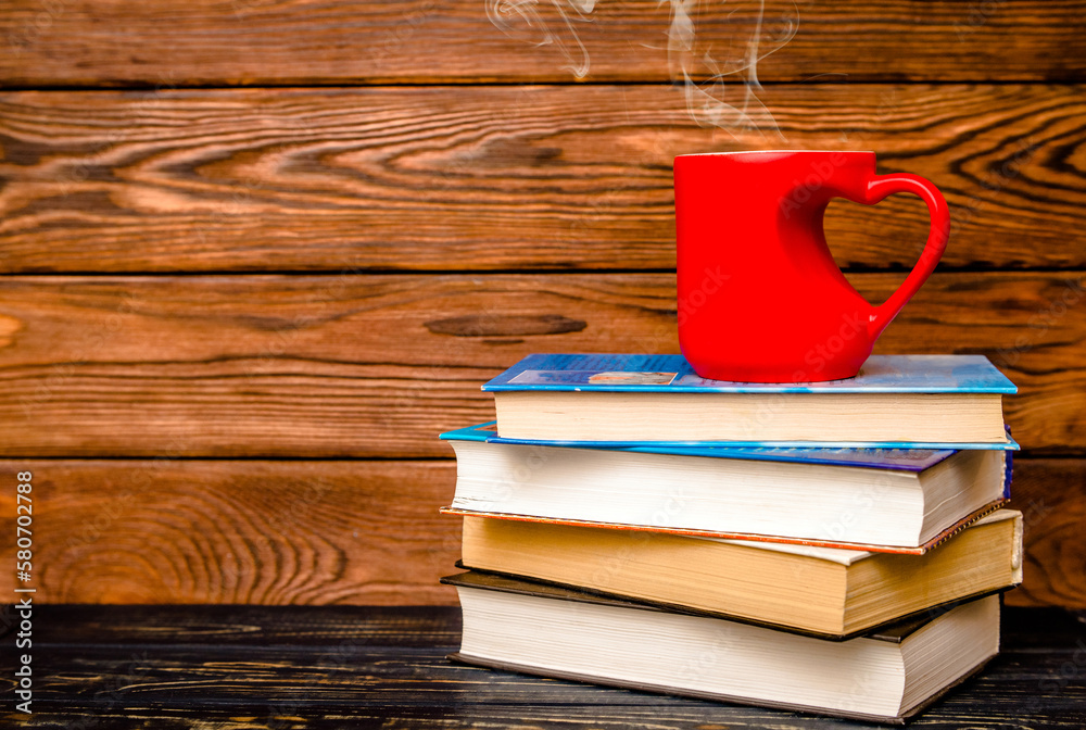  heart shaped mugs is on a stack of books 