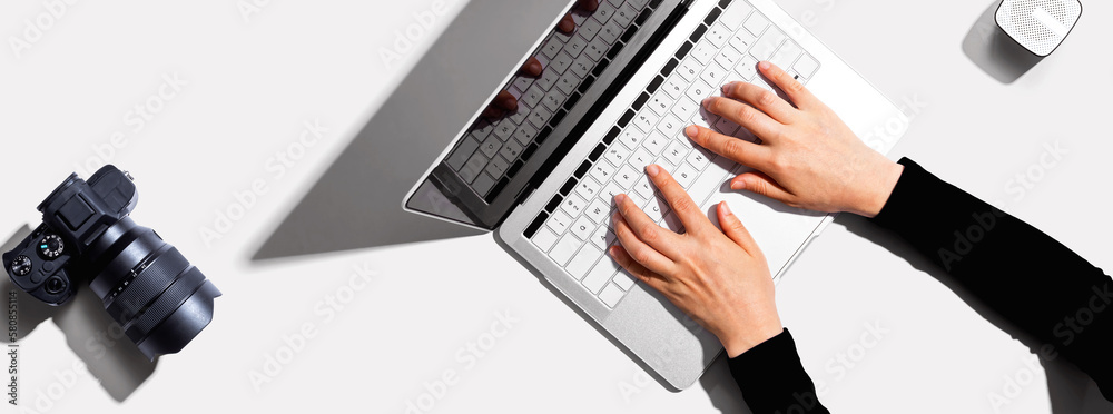 Laptop computer with a SLR camera from above