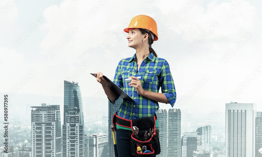 Young building inspector checking outdoor