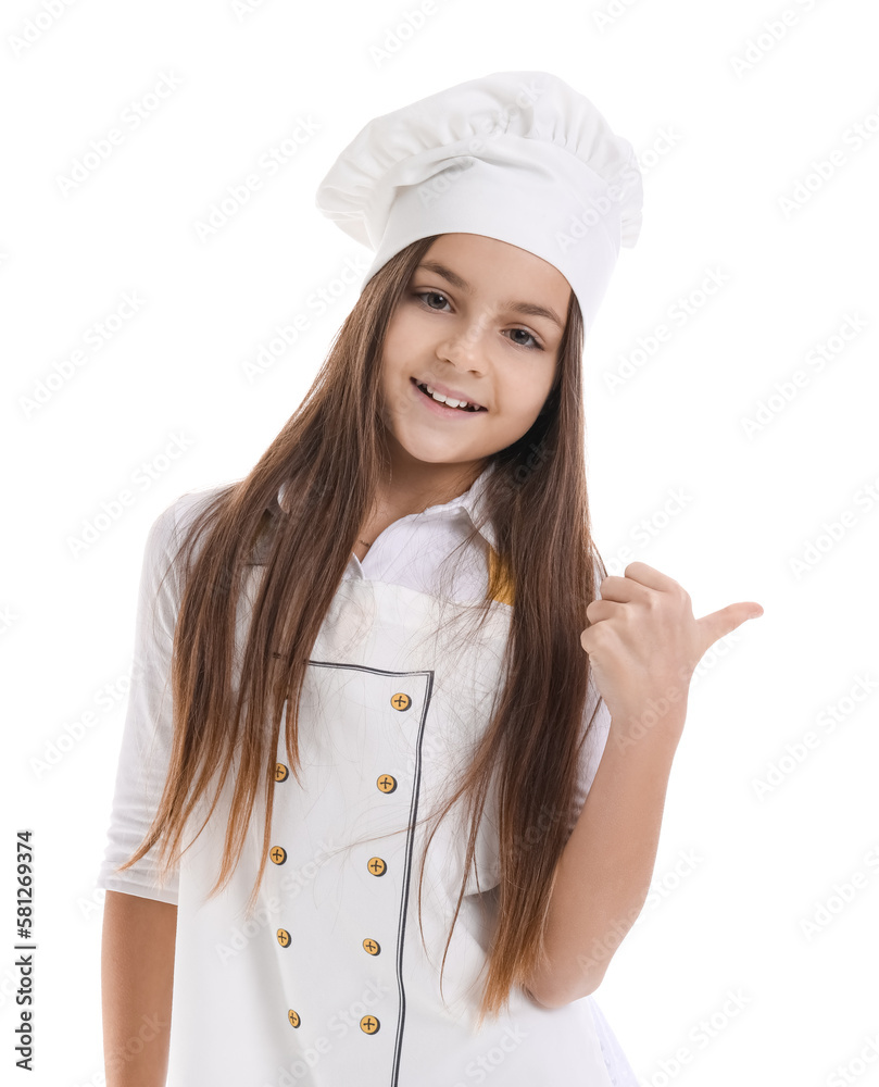 Little baker pointing at something on white background