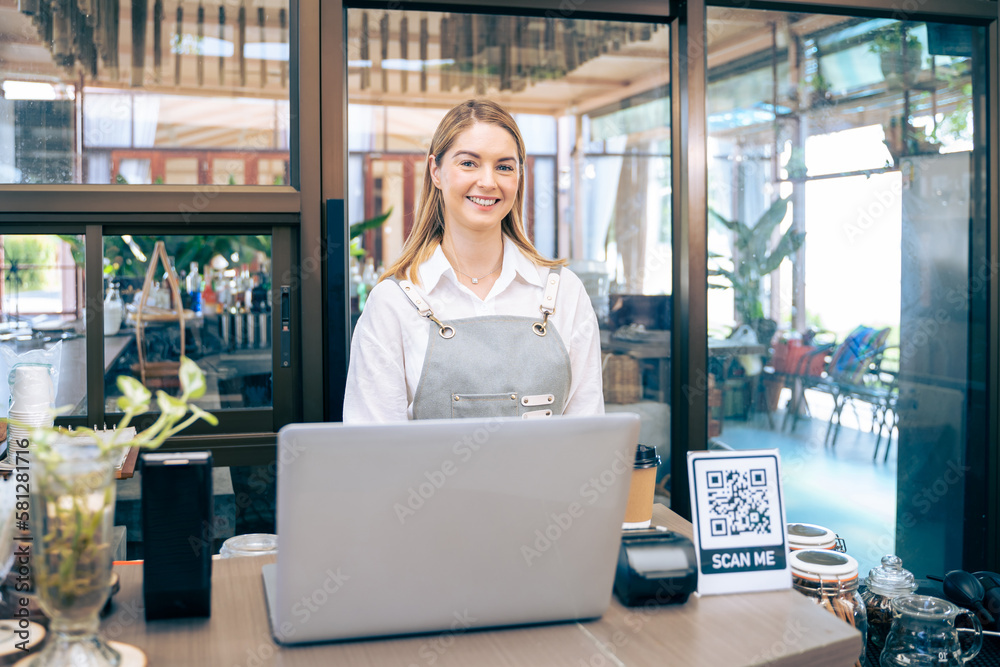 Portrait of Caucasian young barista or waitress working in coffeehouse.