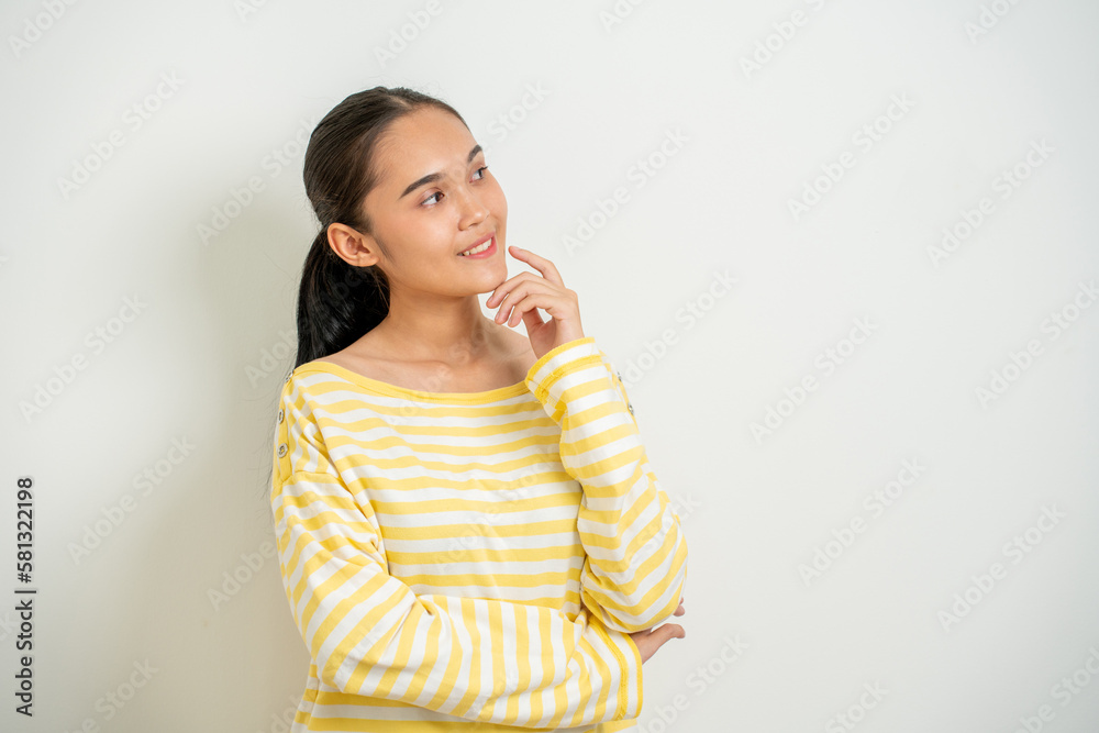 Young Asian woman isolated on white bakcground thinking