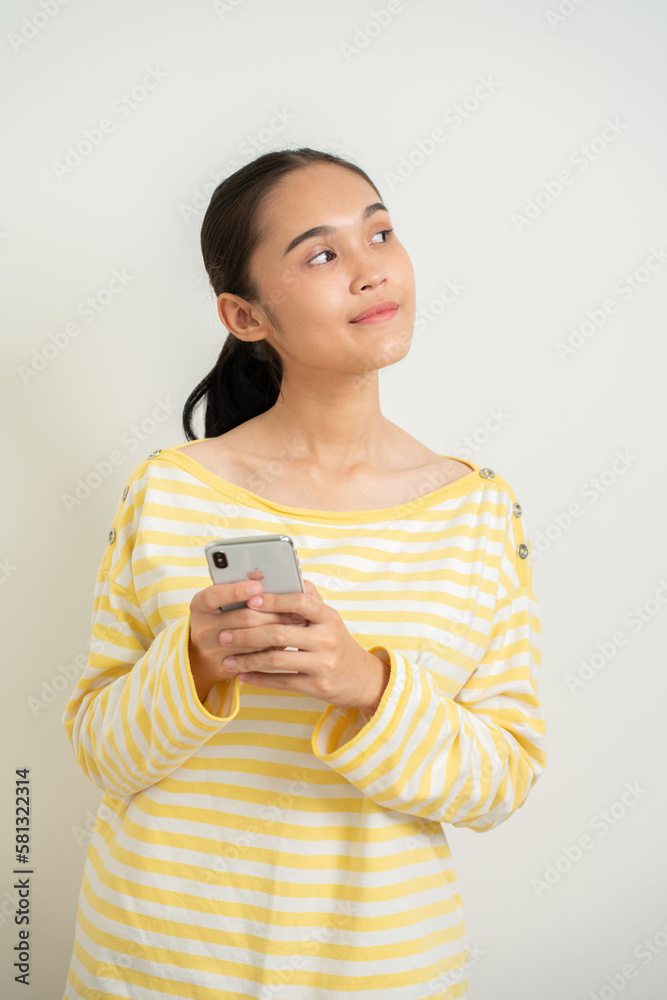 Young Aisan gril over isolated white background surprised and sending a message