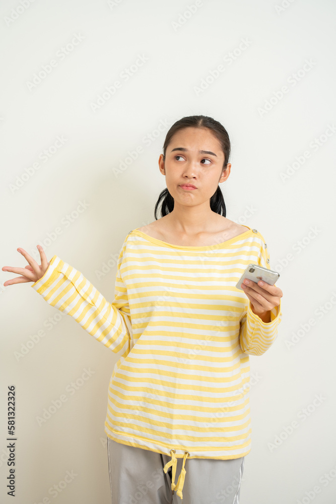 Young Aisan gril over isolated white background surprised and sending a message