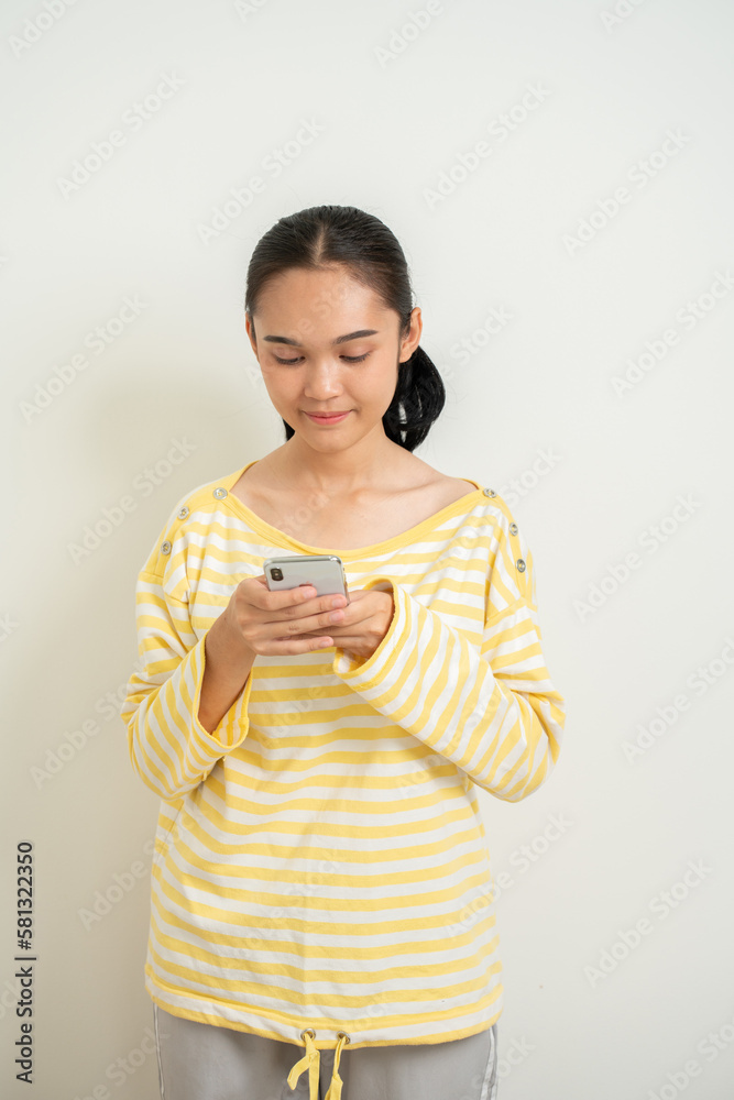 Young Aisan gril over isolated white background surprised and sending a message