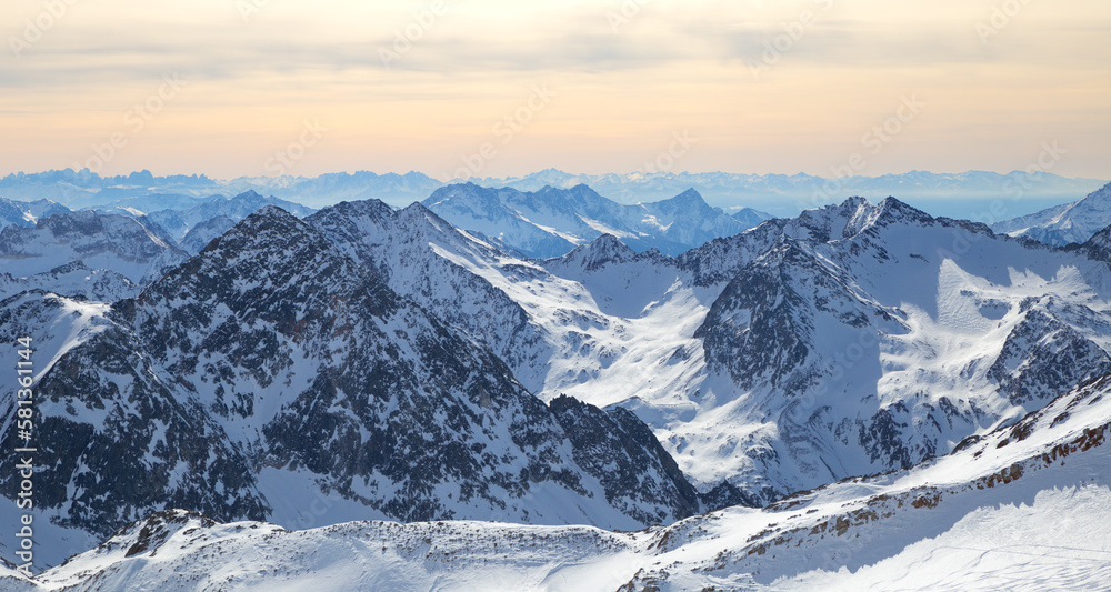 Panoramic view of Alps mountain snowy range with skiing trails, Stubai Glacier