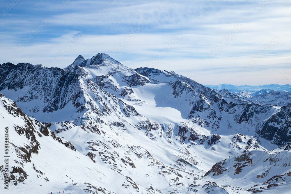 Panoramic view of Alps mountain snowy range with skiing trails, Stubai Glacier