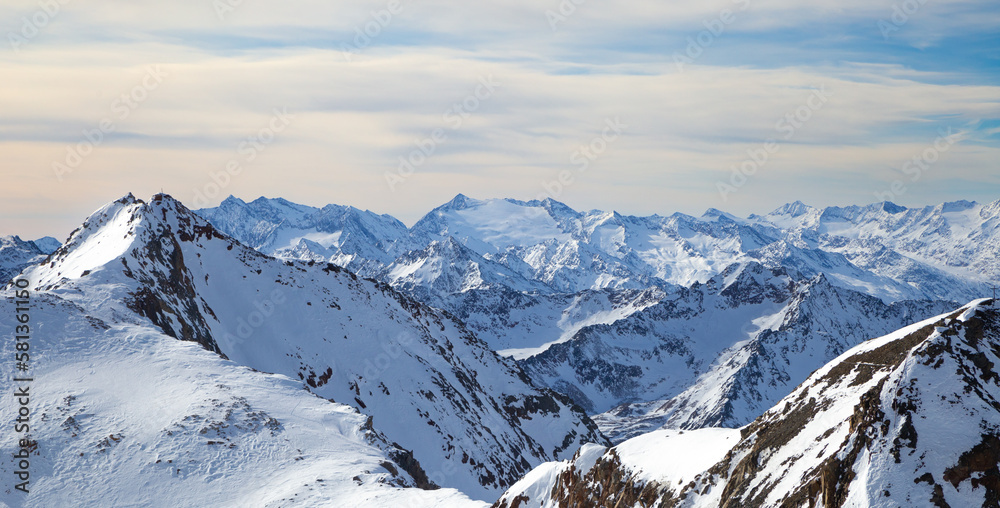 Panoramic view of Alps mountain snowy range with skiing trails, Stubai Glacier